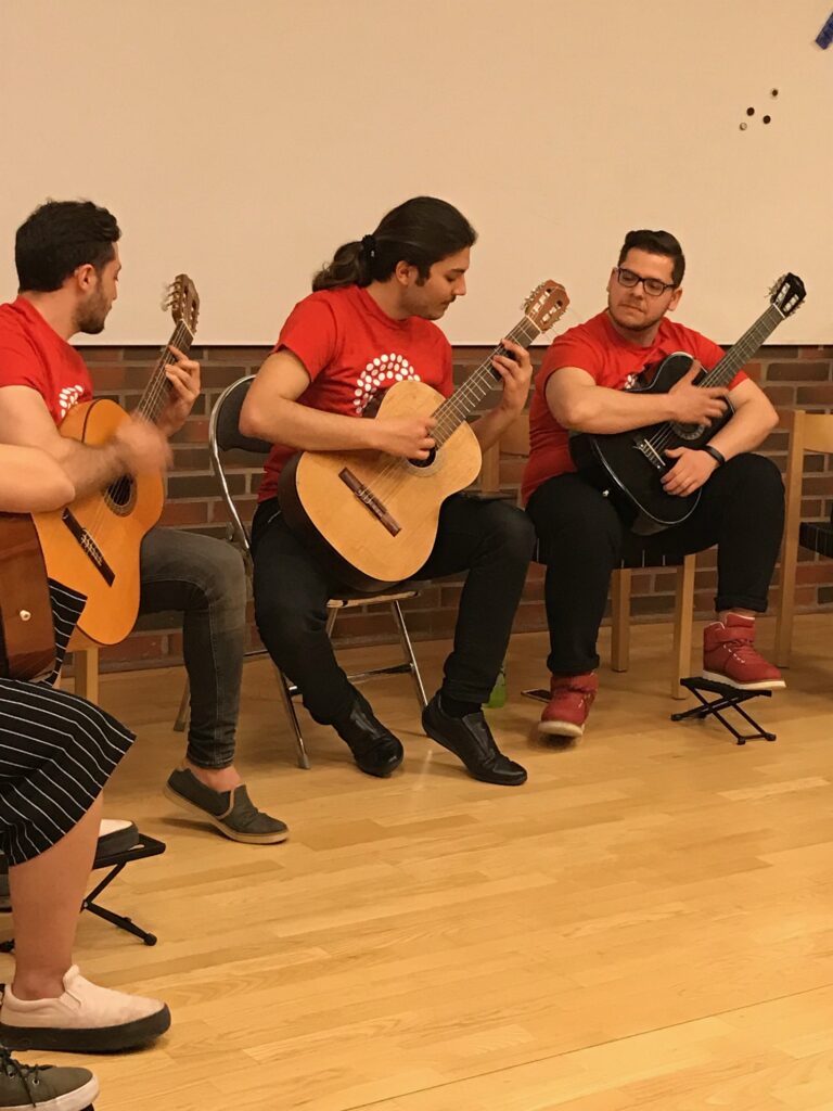 Hadi is performing with the group he is teaching.